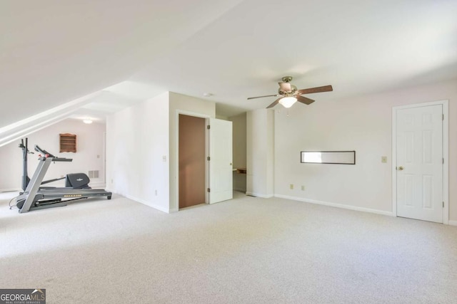 exercise area with carpet flooring, visible vents, baseboards, and a ceiling fan