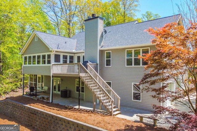 back of house with a patio area, a chimney, stairs, and central air condition unit