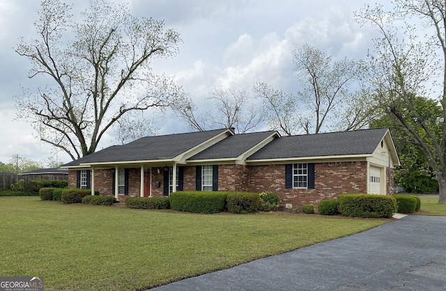 2237 W Elm St, Wrightsville, GA 31096 - single story home featuring an attached garage, driveway, a front yard, and brick siding