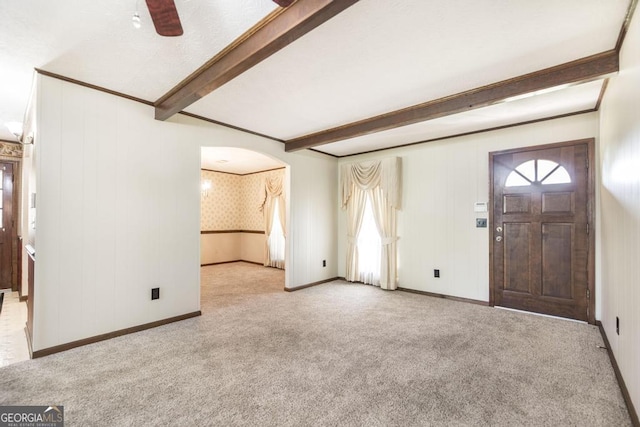 2237 W Elm St, Wrightsville, GA 31096 - entryway featuring arched walkways, carpet, beam ceiling, and ceiling fan