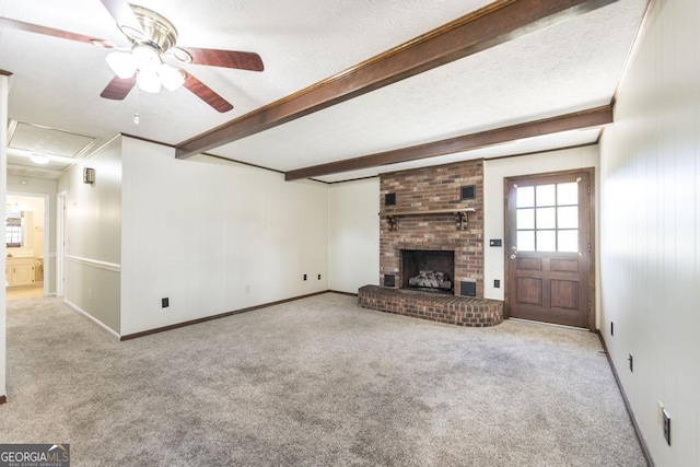 2237 W Elm St, Wrightsville, GA 31096 - unfurnished living room featuring attic access, carpet flooring, a ceiling fan, and beam ceiling