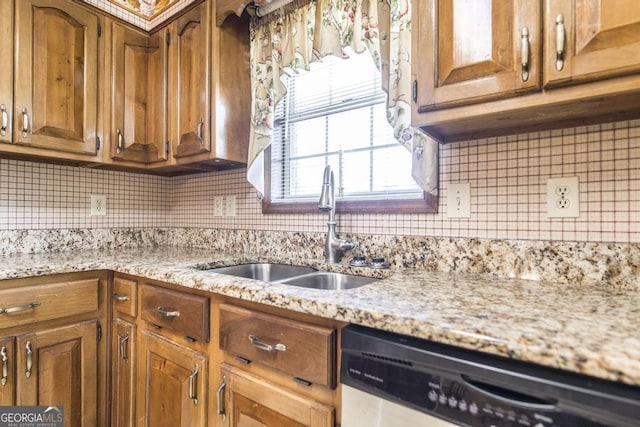 2237 W Elm St, Wrightsville, GA 31096 - kitchen featuring dishwasher, brown cabinetry, decorative backsplash, and a sink