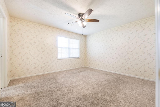 2237 W Elm St, Wrightsville, GA 31096 - carpeted spare room with visible vents, a textured ceiling, and ceiling fan