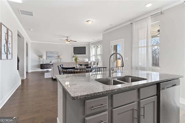 kitchen with gray cabinetry, dishwasher, a sink, and a ceiling fan
