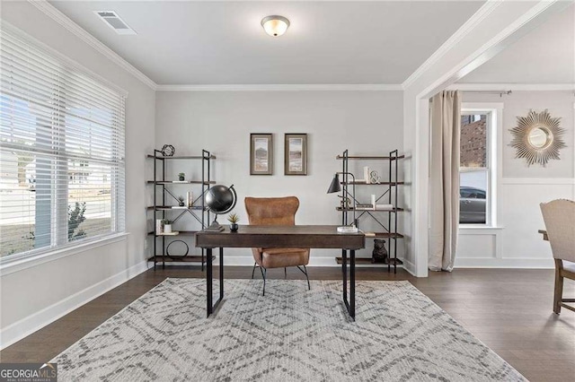 office featuring dark wood-style flooring, ornamental molding, and visible vents