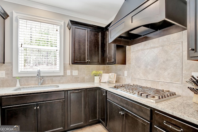 185 Discovery Lake Dr, Fayetteville, GA 30215 - kitchen with custom range hood, dark brown cabinets, decorative backsplash, stainless steel gas stovetop, and a sink
