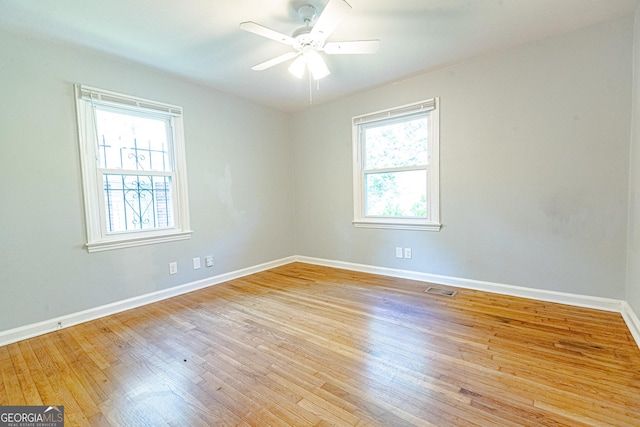 145 Holly Rd NW, Atlanta, GA 30314 - unfurnished room featuring baseboards, a ceiling fan, visible vents, and light wood-type flooring