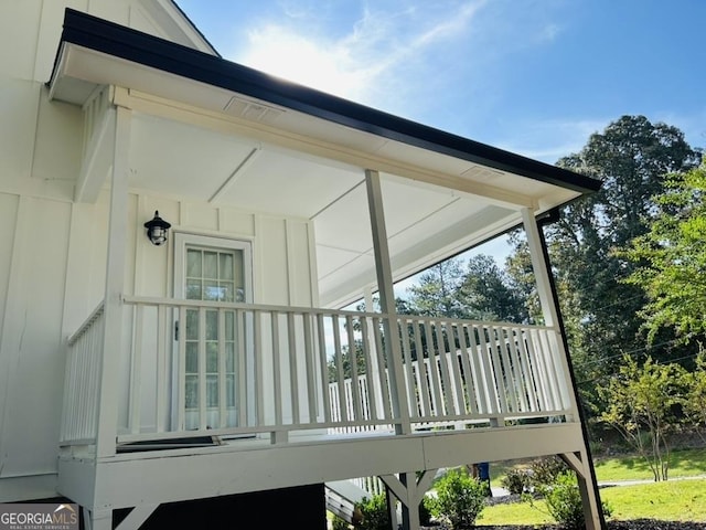 wooden terrace with a porch