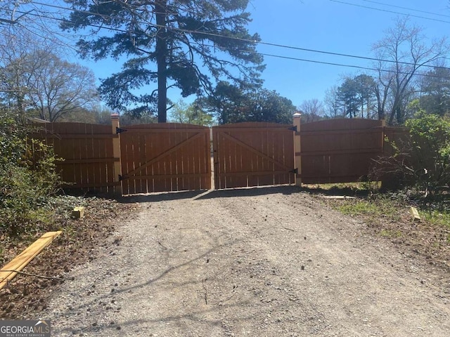 view of gate with fence