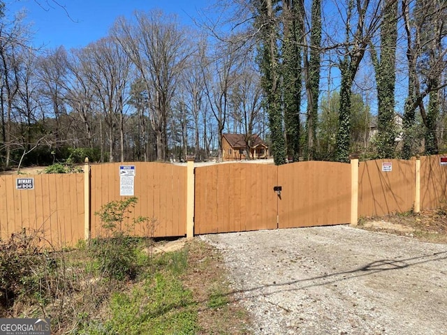 view of gate featuring fence