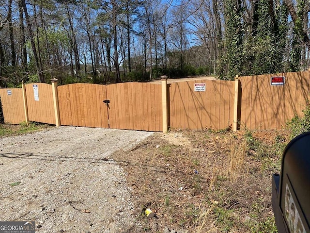 view of gate with fence
