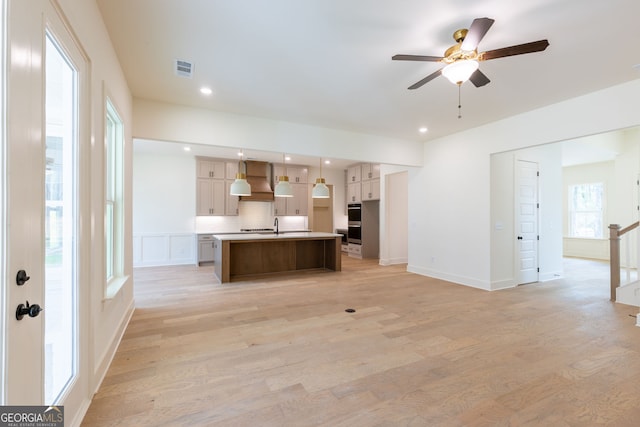 8415 Beryl Overlook, Gainesville, GA 30506 - kitchen featuring ceiling fan, open floor plan, an island with sink, light wood-style flooring, and recessed lighting