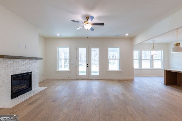 8415 Beryl Overlook, Gainesville, GA 30506 - unfurnished living room with ceiling fan, a fireplace, light wood-style floors, baseboards, and recessed lighting