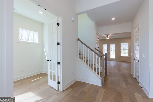 8415 Beryl Overlook, Gainesville, GA 30506 - stairway featuring french doors, wood finished floors, ceiling fan, recessed lighting, and baseboards