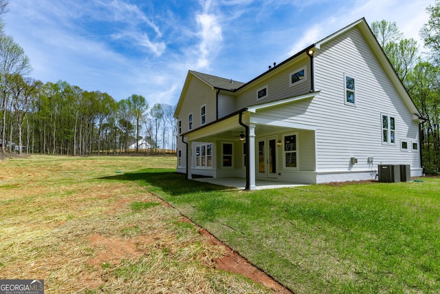 8415 Beryl Overlook, Gainesville, GA 30506 - view of home's exterior with a ceiling fan, a patio area, a yard, and central AC unit
