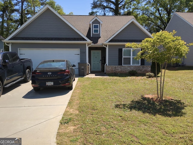 craftsman-style home featuring a garage, driveway, roof with shingles, and a front yard
