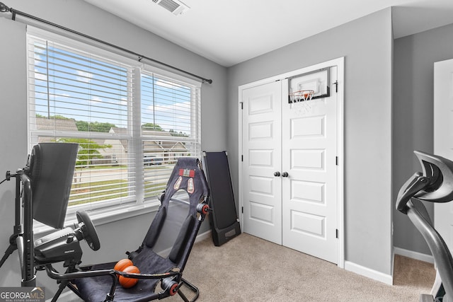 carpeted office with baseboards and visible vents
