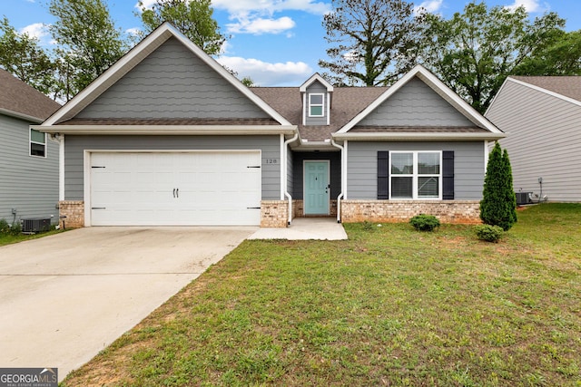 craftsman inspired home featuring concrete driveway, a garage, a front yard, and central air condition unit