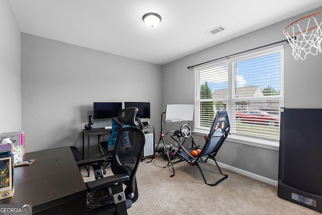 home office featuring baseboards, visible vents, and carpet