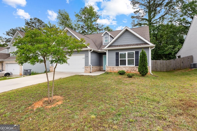 128 Savannah Way, Milner, GA 30257 - craftsman-style house with fence, a front yard, an attached garage, central air condition unit, and driveway