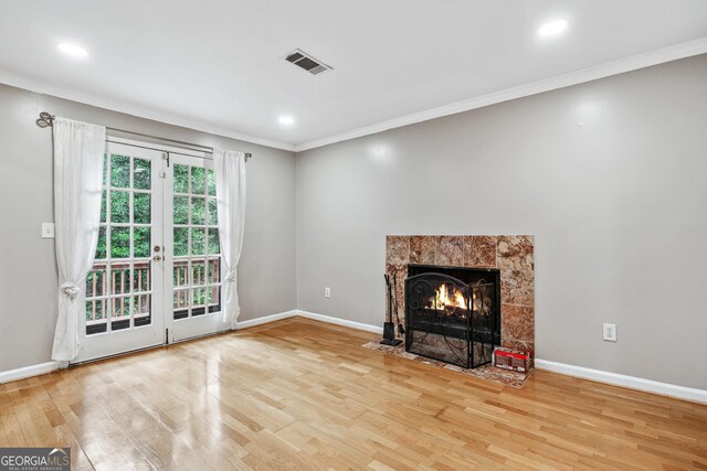 2404 Northlake Ct, Atlanta, GA 30345 - unfurnished living room featuring ornamental molding, visible vents, wood finished floors, a premium fireplace, and baseboards