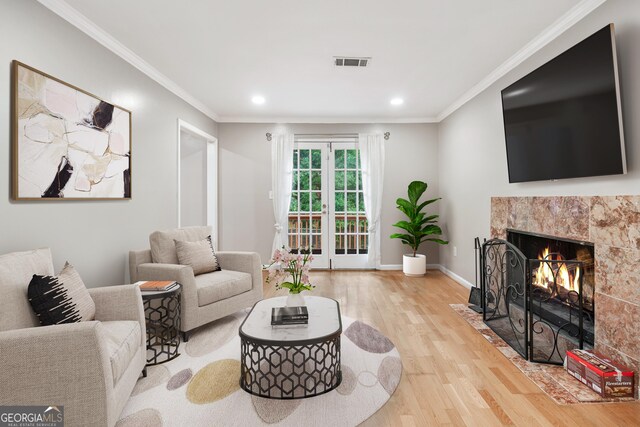 2404 Northlake Ct, Atlanta, GA 30345 - living room featuring recessed lighting, a fireplace, crown molding, visible vents, and light wood finished floors