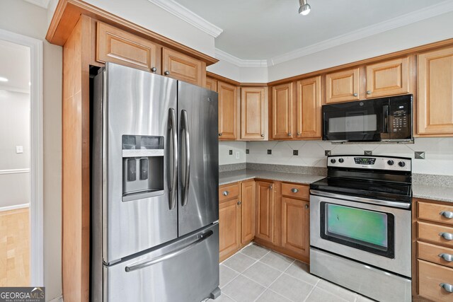 2404 Northlake Ct, Atlanta, GA 30345 - kitchen featuring stainless steel appliances, light tile patterned floors, and crown molding