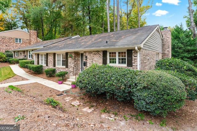 2404 Northlake Ct, Atlanta, GA 30345 - view of front of property with brick siding and a chimney
