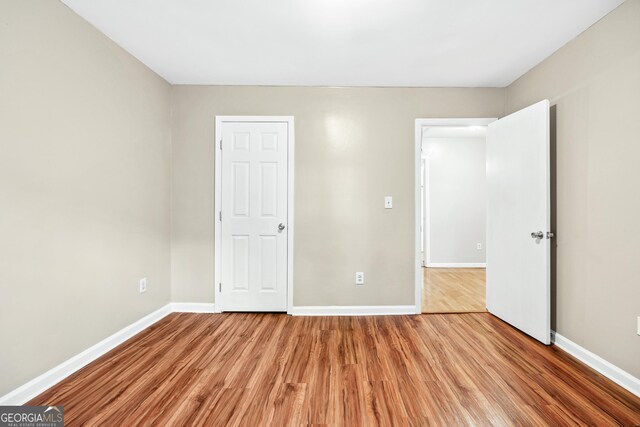 2404 Northlake Ct, Atlanta, GA 30345 - unfurnished bedroom featuring wood finished floors and baseboards