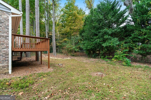 2404 Northlake Ct, Atlanta, GA 30345 - view of yard with a deck and fence