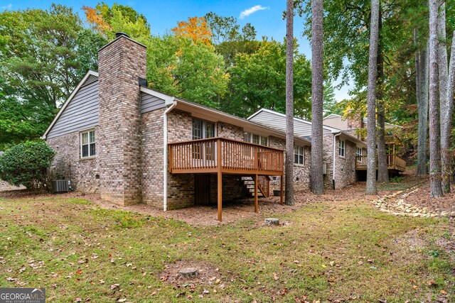 2404 Northlake Ct, Atlanta, GA 30345 - back of property with central AC, a yard, a chimney, stairway, and a wooden deck