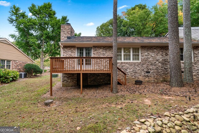 2404 Northlake Ct, Atlanta, GA 30345 - back of house with central air condition unit, a chimney, crawl space, brick siding, and a wooden deck