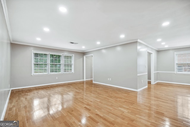 2404 Northlake Ct, Atlanta, GA 30345 - unfurnished living room with visible vents, baseboards, crown molding, light wood finished floors, and recessed lighting
