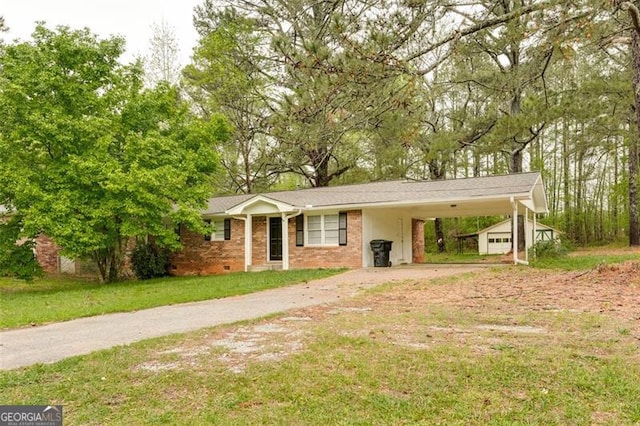 ranch-style home featuring a carport, brick siding, driveway, and a front lawn