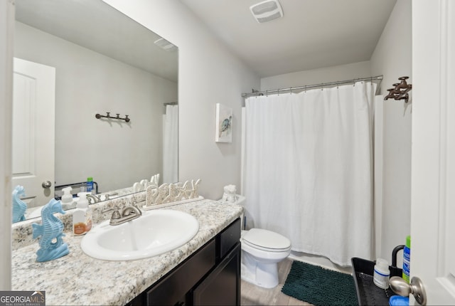 3464 Enterkin Ln, Atlanta, GA 30349 - bathroom with vanity, toilet, and a shower with curtain