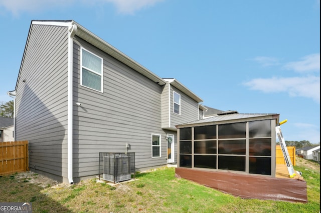 3464 Enterkin Ln, Atlanta, GA 30349 - rear view of property with a sunroom and central air condition unit