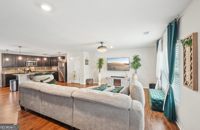 3464 Enterkin Ln, Atlanta, GA 30349 - living room with wood finished floors and baseboards