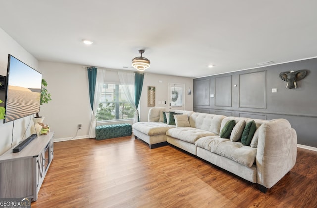 3464 Enterkin Ln, Atlanta, GA 30349 - living area with light wood-type flooring, baseboards, and recessed lighting