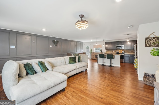 3464 Enterkin Ln, Atlanta, GA 30349 - living area with light wood finished floors and recessed lighting