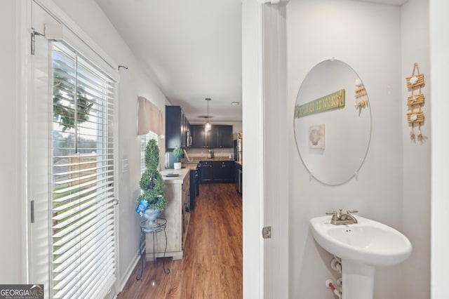 3464 Enterkin Ln, Atlanta, GA 30349 - bathroom with wood finished floors, baseboards, and a sink