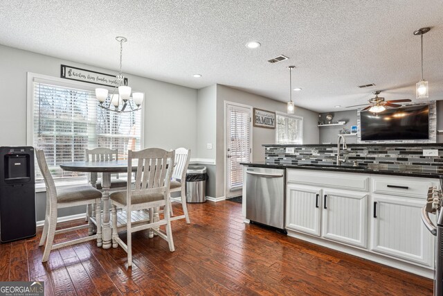 161 Hunters Chase, Mcdonough, GA 30253 - kitchen featuring dark countertops, visible vents, decorative backsplash, dishwasher, and a sink