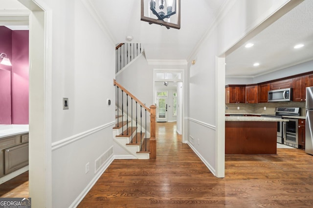 171 Riverview Trl, Roswell, GA 30075 - foyer featuring crown molding, stairway, wood finished floors, and recessed lighting