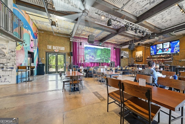 171 Riverview Trl, Roswell, GA 30075 - dining space featuring a towering ceiling and concrete flooring