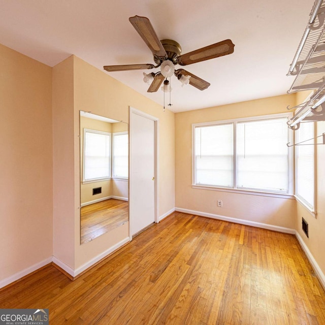 unfurnished bedroom featuring visible vents, baseboards, and light wood finished floors