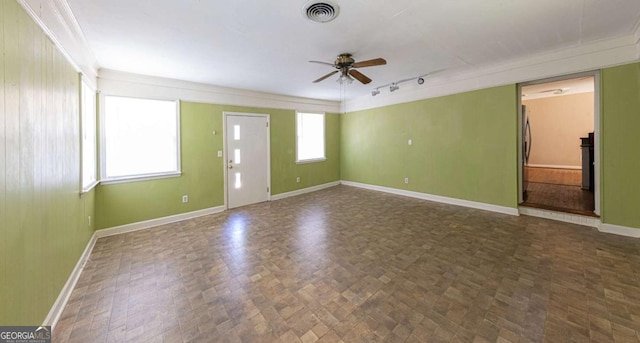 unfurnished room with visible vents, ceiling fan, track lighting, and baseboards