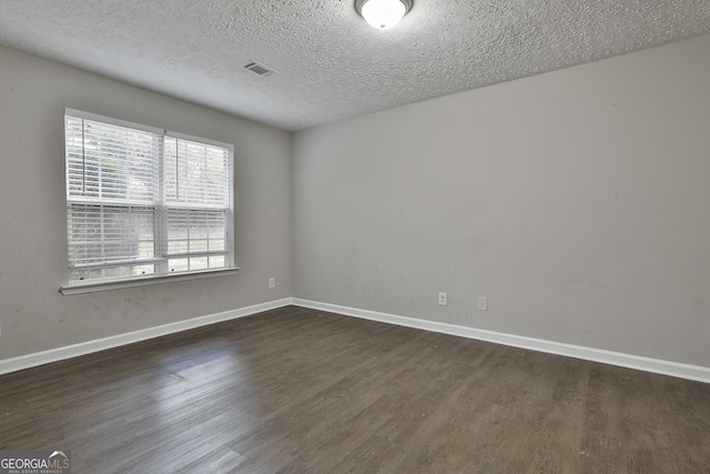 28 Willow Ridge Dr, Hampton, GA 30228 - spare room with visible vents, a textured ceiling, baseboards, and wood finished floors