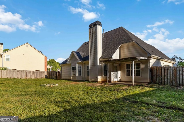 113 Highgrove Pl, Mcdonough, GA 30253 - rear view of house featuring a lawn, a chimney, a patio area, a shingled roof, and a fenced backyard