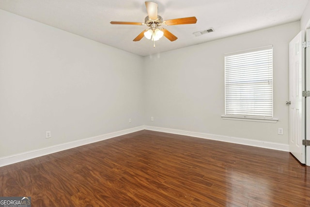 113 Highgrove Pl, Mcdonough, GA 30253 - spare room featuring lofted ceiling, a ceiling fan, baseboards, visible vents, and dark wood-style floors