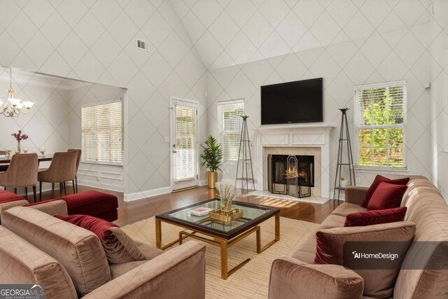 113 Highgrove Pl, Mcdonough, GA 30253 - unfurnished living room featuring wood finished floors, high vaulted ceiling, a lit fireplace, visible vents, and baseboards
