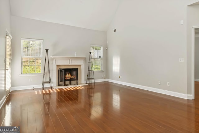 113 Highgrove Pl, Mcdonough, GA 30253 - unfurnished living room with a chandelier, a wealth of natural light, visible vents, and a premium fireplace